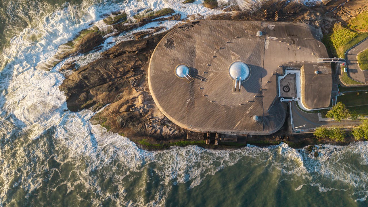 team-01 Stunning aerial view of Fort Copacabana's unique architecture surrounded by ocean waves in Rio de Janeiro.